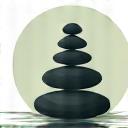 Calm flowing water with a single smooth stone, symbolizing stress relief.